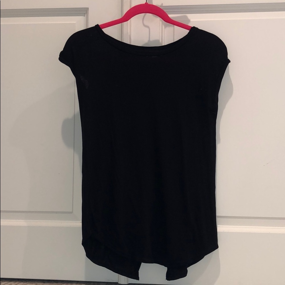 A black top with open cut in back